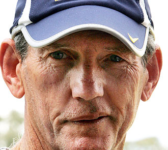 Jack Gibson is considered by many to be the greatest rugby league mentor ever and arguably the greatest Australian coach of any sport. His record is certainly something to behold. The rugged yet highly intelligent Gibson made an impact right away in coaching. In 1967, Gibson took over as head coach from Bert Holcroft at Eastern Suburbs after the Roosters had gone winless in 1966 and who had gone 8-63-1 over the previous four years, winning three wooden spoons in the process. In 1967, Eastern Suburbs returned to the semi-finals and did the same in 1968 with 13 wins and 14 wins respectively. The turnaround of the Roosters was almost entirely Gibson’s doing. He did very little outside recruitment, preferring to promote from within with the likes of Johnny Peard, Bill Mullins, Johnny Mayes and “Bunny” Reilly- the core of the Roosters premiership teams in ’74 and ’75- all developing and debuting on Gibson’s watch. Gibson had turned the Roosters from easybeats to a fast, defence oriented team who could win football games. Gibson then moved to the Dragons in 1970 and in two years took the team to the finals both times with 1971 being the first time the club was back in the decider since their run of 11 straight titles ended in 1966. In 1971, the Dragons made the Grand Final in all three grades. He is best remembered at the Dragons for cancelling training one evening and dragging all three grades in to watch a motivational talk by Vince Lombardi. It turned the Dragons around after winning only four of their first eight games, propelling them to the ’71 decider. In 1973, his only season in charge of Newtown, Gibson took the Blue Bags to a preliminary final and their only ever club championship. It was the only time Newtown made the finals between 1966 and 1981. Gibson then returned to Eastern Suburbs in 1974 and proceeded to guide the Roosters to premierships in 1974 and 1975. The Roosters teams of those years were two of the most dominant ever with Easts going 43-7 while also beating St Helens in the first World Club Championship. The Roosters teams of ’74 and ’75 played brilliant attacking football with the likes of Peard, Mullins and Russell Fairfax in the backline and Ron Coote and Arthur Beetson ball-playing in the middle of the ruck. After the Roosters dropped off in 1976, Gibson had two fruitless seasons at South Sydney before moving to Parramatta. In three years at Parramatta, Gibson led the Eels to their first three titles and was the last coach to guide a team to a hat-trick of premierships. “Ding dong the witch is dead” Gibson proclaimed upon the Eels first title. In his time at the Eels, Gibson went 61-22-1 and moulded a team of youthful talent like Peter Sterling and Brett Kenny with aged warriors like Mick Cronin and Ray Price into a premiership unit. He finished his coaching career with three nothing years at Cronulla, concluding that waiting for a Sharks premiership was like “leaving the porch light on for Harold Holt”, before guiding New South Wales to a series win in 1990. Gibson was both lauded at the time for his innovation and revered by historians for his contribution to coaching. Gibson, known as The Supercoach, took a great deal from American Football and brought it to rugby league including statistics, the use of video and motivational techniques. Gibson also solidified the role of the coach at the top of the pecking order in rugby league clubs as he did away with selectors and other hangers-on. In 2008, he was named coach of the Team of the Century. Yet a victory on Sunday evening for the Dragons will see Bennett supersede Gibson. Bennett’s record speaks for itself. In his one year at Canberra, he took the club to their first Grand Final and has been widely credited as laying the groundwork for the Raiders dynasty of the late eighties and early nineties. At Brisbane, he won six premierships, never losing a Grand Final and making the finals every year from 1992 to 2008 in a record unparalleled in modern Australian sport. Bennett had a remarkable win rate of 63.7% at the Broncos and consistently produced and developed new talent. This year, only the second season after Bennett’s departure, Brisbane missed the finals for the first time in nearly two decades. While at Brisbane, Bennett also coached Queensland and Australia with great success. Bennett won 12 of 16 Tests and led Queensland to four series victories in three separate decades. He has been at St George-Illawarra only two years yet he has not only guided them to consecutive minor premierships and the Dragons first Grand Final in eleven years but completely reshaped their identity, turning them from a glitzy team with a soft underbelly to a hardened and well drilled team that oozed confidence and composure. If the Dragons win this week, Bennett will become the first Dragons coach in 31 years to guide the club to a premiership, succeeding where the likes of Roy Masters, Ted Glossop, Craig Young, Brian Smith, David Waite, Andrew Farrar and Nathan Brown have failed. In the argument between Bennett and Gibson, Gibson is often given the edge because we revere the past far more than the present. Gibson is rightly lauded as an innovator and a coaching genius but he benefitted from an era that lacked a salary cap and general professionalism. The great Roosters and Eels teams he coached never would have survived the harsh salary cap era while there is no doubt that the gap in professionalism among both players and coaches was far greater in Gibson’s era than today. Today, professionalism is demanded while in Gibson’s day he was one of the few professionals in an amateur game. Gibson also achieved very little at a rep level and when examining a coaching resume that does mean something. Bennett, meanwhile, built the Raiders up from very little and must at least get partial credit for their premierships in 1989 and 1990.after debuting Laurie Daley, Kevin Walters, Glenn Lazarus, Peter Jackson and Steve Jackson in ’87. He led the Broncos dynasty to a success unmatched in any sport with a hard salary cap, constantly developing and nurturing greats. He made hard decisions like firing Wally Lewis in order to keep the club great and as such they did not miss a finals campaign from 1992 to 2008 on his watch. Bennett instilled a culture of success at the Broncos and that led the club to six premierships and not a single Grand Final loss. Remarkably, Bennett constantly reinvented the Broncos, changing their style and nature to adapt to the circumstances of the competition. The defence oriented 2000 Broncos looked nothing like the attacking 1992 Broncos while the teams led by Alan Langer were far different to those led by Darren Lockyer. Bennett now stands on the verge of history at the Dragons. Bennett has thrived in more difficult circumstances than Gibson. Bennett certainly benefitted from coaching in a one team town but that was more than offset by modern professionalism, the salary cap and the damage State of Origin reeked on his team each and every year. Roy Masters said “I believe Wayne Bennett stands somewhere below Jack Gibson, which is just above God.” That may be about to change. Bennett needs a title at a second club to surpass Gibson as rugby leagues finest ever coach. But make no mistake: a win on Sunday night and Wayne Bennett becomes the man.